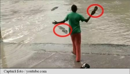 o-femeie-filmata-in-timp-ce-pune-pe-fuga-un-crocodil-cu-un-papuc