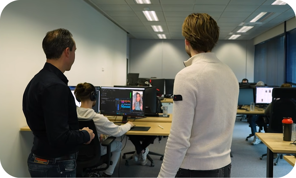 Hyred team reviewing a creator video in the office