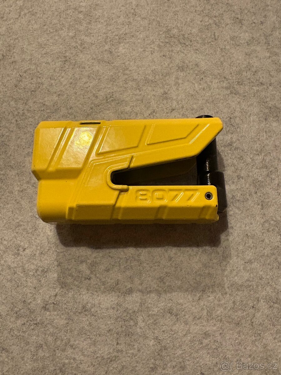 Zámek na brzdový kotouč, s řetězem. Abus