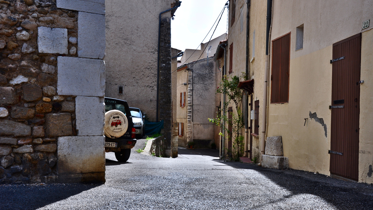 We camped in the south of France and made frequent trips to small villages in the surrounding area to visit markets. This is a small street in Riez, France.