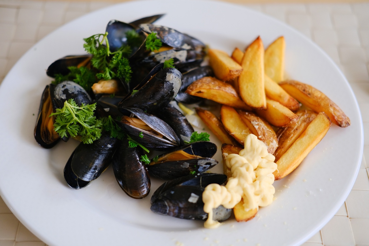 Belgian moules-frites, out of the pan and on a plate, with high-quality mayonaise, in my father's kitchen, Tilburg, 2021.