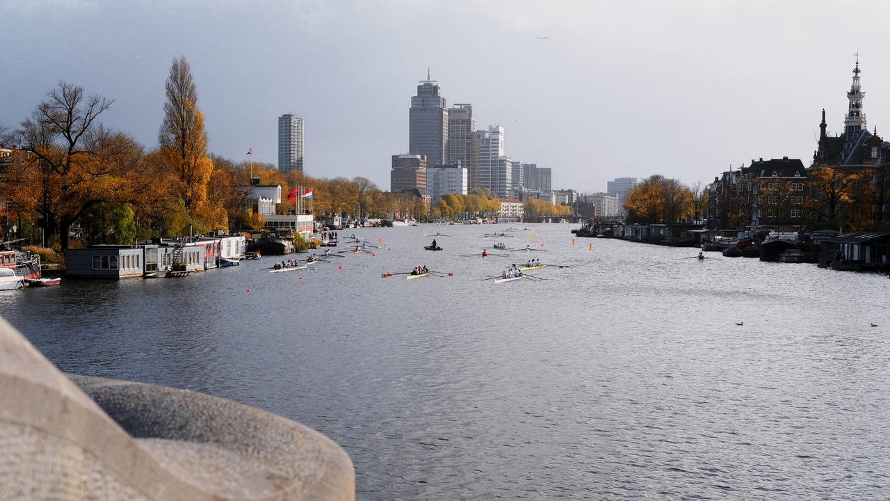 A rowing competition in the Amstel in Amsterdam during fall.