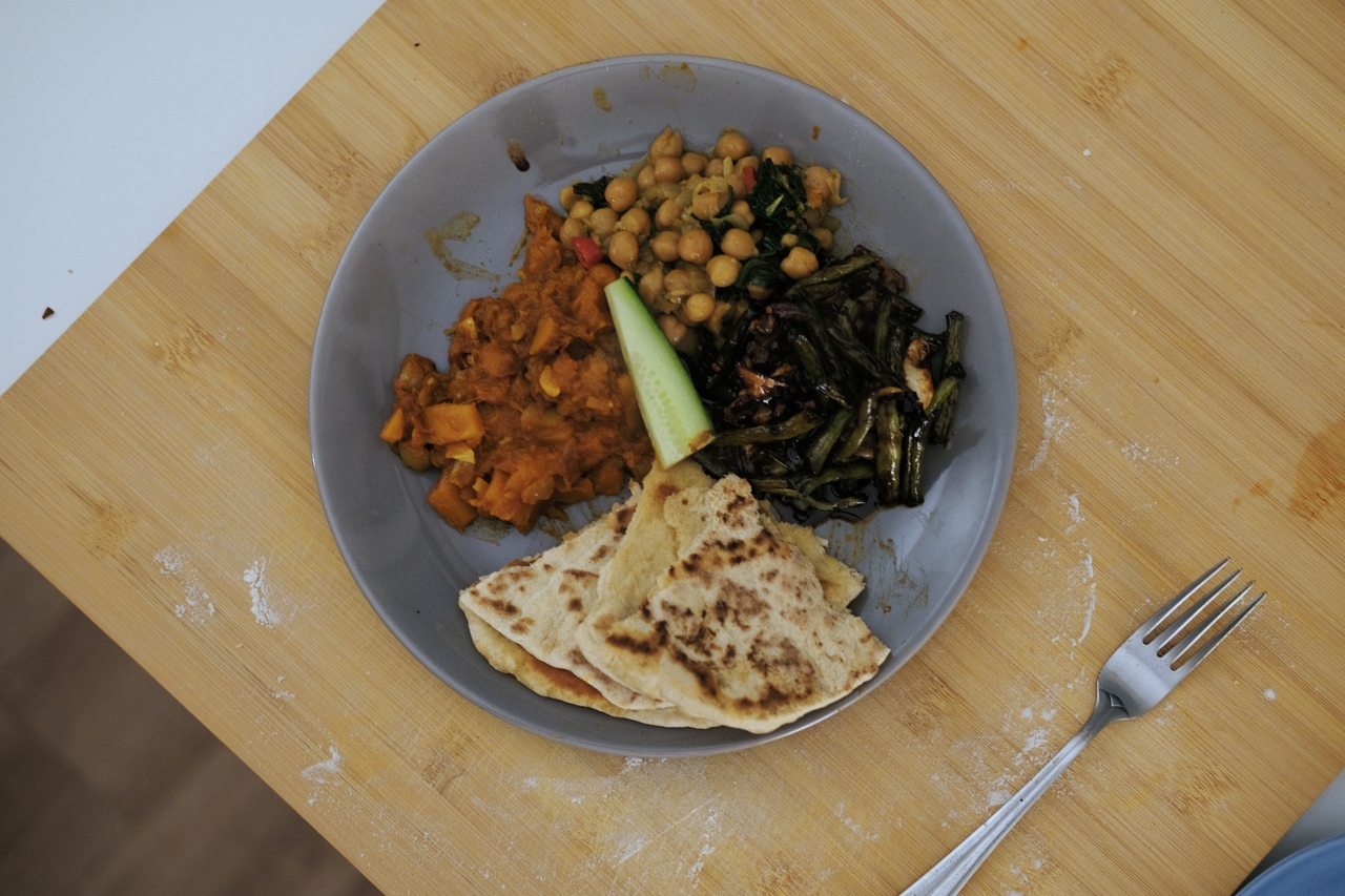 Simple Caribbean roti with three types of curries, in my apartment in Amsterdam, 2022.