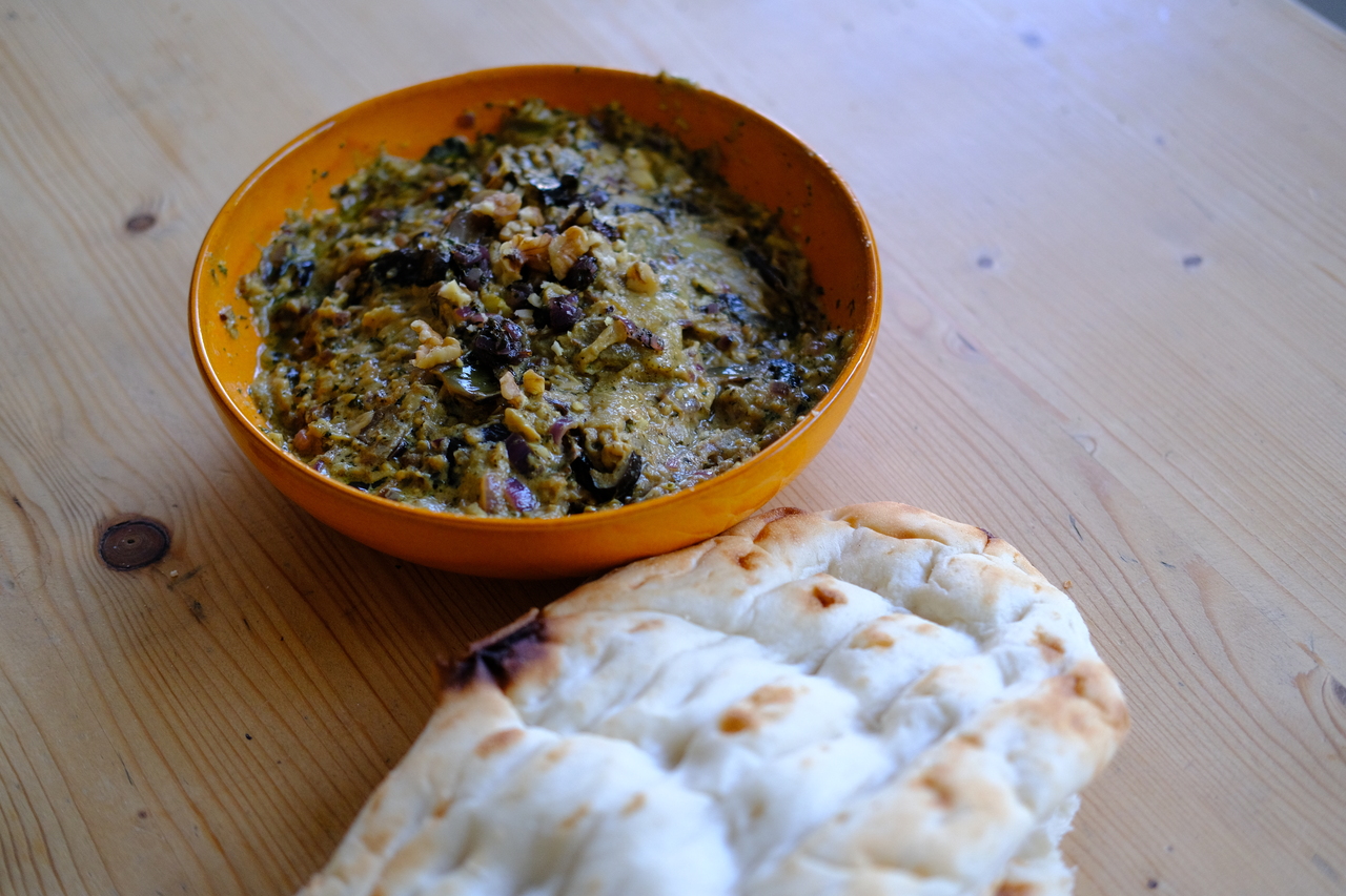 Khask-e bademjan topped with walnuts and caramelized onions, served with lavash, in my apartment in Amsterdam, 2022.