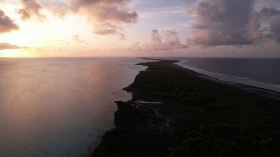 Toau Aerial drone view, over the atoll and lagoon at sunset, 5K4