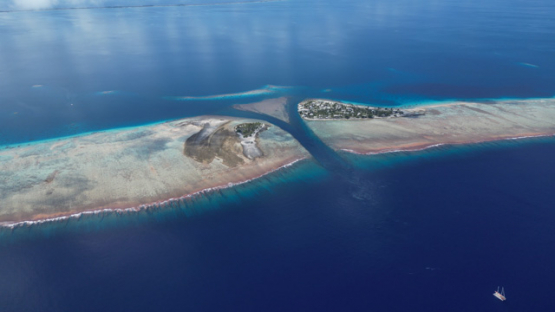 Aerial drone view of the atoll Raroia, lagoon and pass, 4K UHD