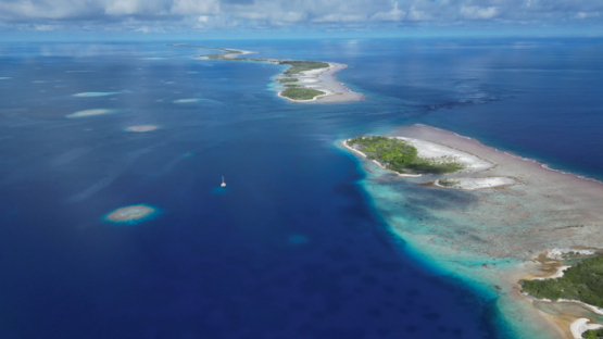 Aerial drone view of the atoll Tahanea, lagoon and islets, and pass, 4K UHD