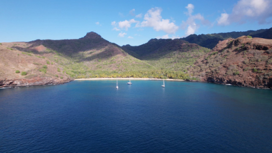 Tahuata, aerial drone view, sail boats in the bay, marquesas islands, Polynesia, 5K4