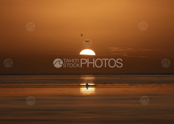 sunset, outrigger in the lagoon, French Polynesia