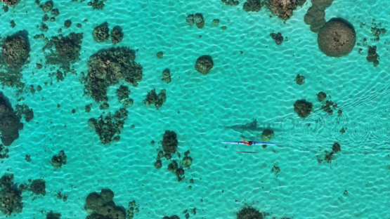 Aerial view by drone, Outrigger in the lagoon, French Polynesia, 4K UHD
