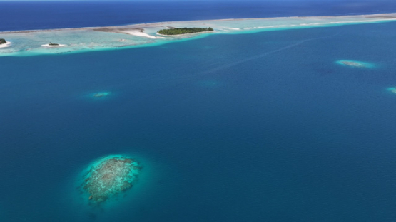 Aerial drone view of the atoll Raroia, lagoon and islets, 4K UHD