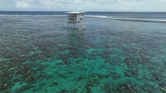 Aerial view by drone, Teahupoo and the new surf judges tower, 4k UHD