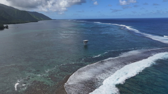 Aerial view by drone, Teahupoo, surf judges tower on the barrier reef, 4k UHD