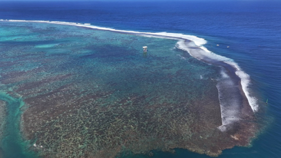 Aerial view by drone, Teahupoo, surf judges tower on the barrier reef, 4k UHD