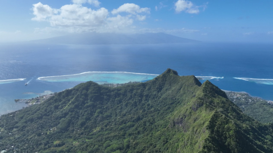 Over Mou a Puta aerial drone view, Moorea mountain, 4K UHD