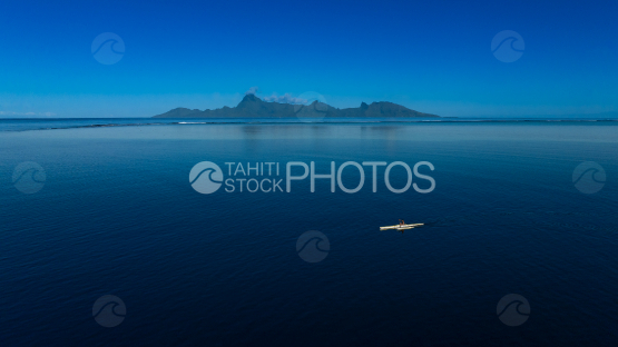 Outrigger canoe in the lagoon of Tahiti, Background Moorea, French Polynesia