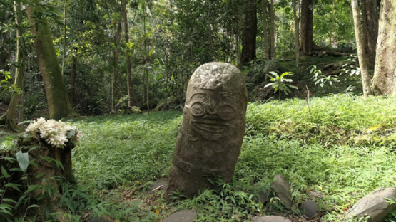 Aerial drone view, Smiling Tiki, Hiva Oa, Utukua, Marquesas islands, Polynesia, 4K UHD