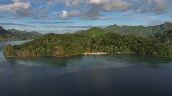 Lagoon and Lush Mountains of Huahine Island,  Drone Aerial View of Society Archipelago, French Polynesia
