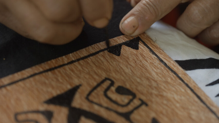 Marquesan Woman Painting Traditional Tapa Cloth