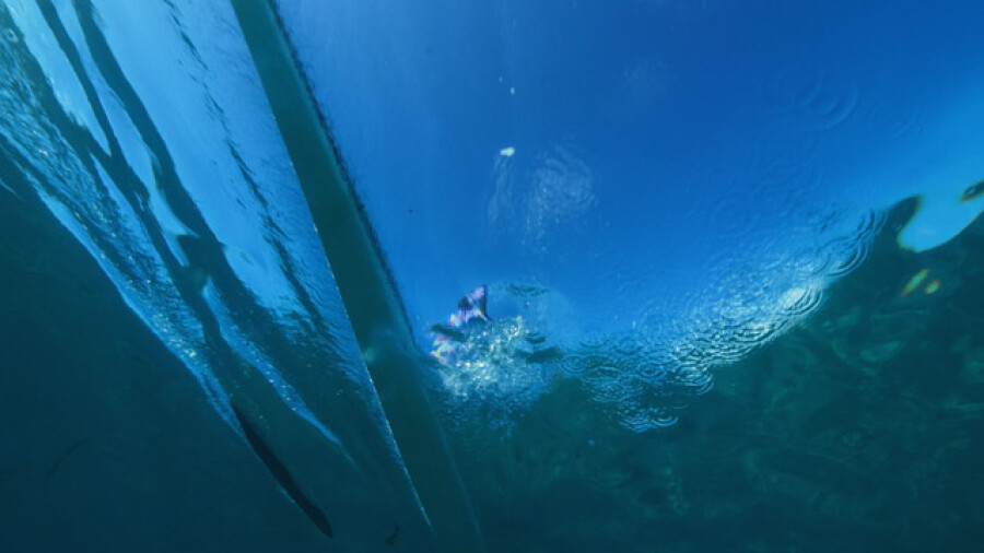 Teahupoo Va'a Outrigger Canoe Underwater View